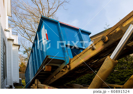 Unloading empty dumpster, recycle waste and Unloading empty dumpster, recycle waste and 60891524