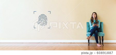 Fingerprint biometric identity with young woman 60891887
