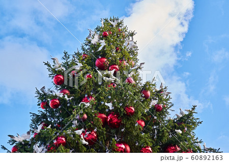Decorated Christmas tree with big red balls and 60892163