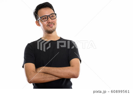 Studio shot of young Asian man thinking while wearing eyeglasses 60899561