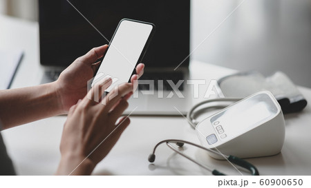 Cropped shot of young professional doctor using 60900650