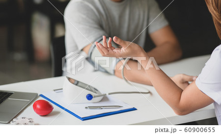 Close-up view of professional doctor checking 60900655