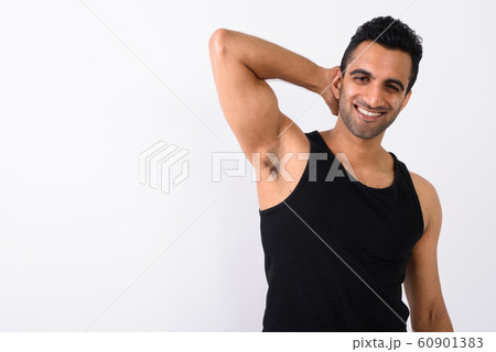 Young handsome Indian man against white background Young handsome Indian man against white background 60901383