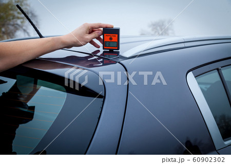 Measuring the thickness of the car paint coating 60902302