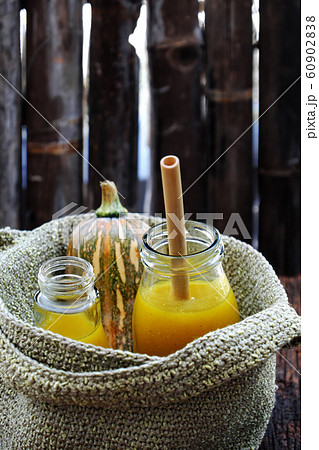 butternut squash milk bottle, yellow healthy, nutritious drink for breakfast  60902838