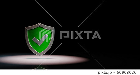 Metallic Shield Shape with Tick Symbol Spotlighted on Black Background Metallic Shield Shape with Tick Symbol Spotlighted on Black Background 60903026