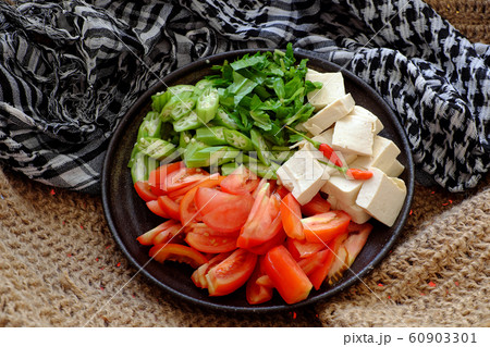 Raw material for Vietnamese vegan soup from okra, tofu, tomato, Eryngium Raw material for Vietnamese vegan soup from okra, tofu, tomato, Eryngium 60903301