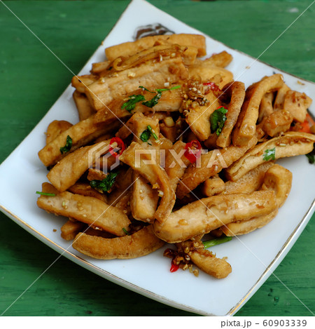 fried tofu cook with sauce and citronella, chilli, Vietnamese food for vegetarian healthy eating fried tofu cook with sauce and citronella, chilli, Vietnamese food for vegetarian healthy eating 60903339