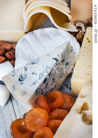 types of different cheese mozzarella, brie, Roquefort, Maasdam, etc. on the table 60905414