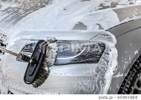 Car cleaned at manual carwash brush leaving 60905868