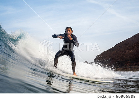 surfer riding waves on the island of fuerteventura surfer riding waves on the island of fuerteventura 60906988