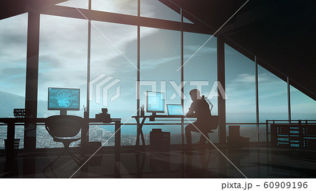 Male web developer works at a computer in his office. 60909196
