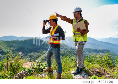 Engineer man with laptop point to forward Engineer man with laptop point to forward 60911081