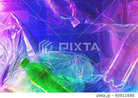 Plastic bottles on plastic background in neon lights. 60911686