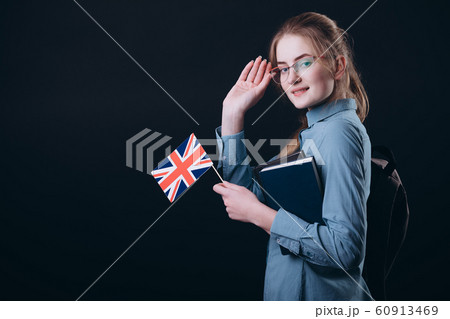 Young English Student Girl With British Flag Adjusting Glasses 60913469