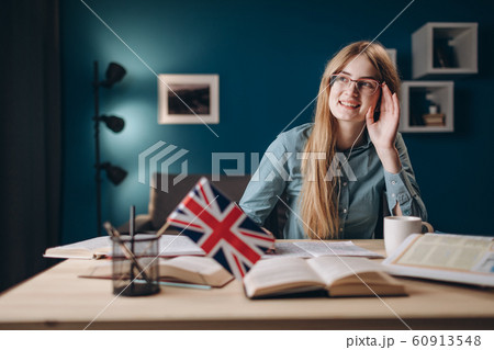 Enthusiastic Ginger Student Girl Adjusting Her Glasses Enthusiastic Ginger Student Girl Adjusting Her Glasses 60913548