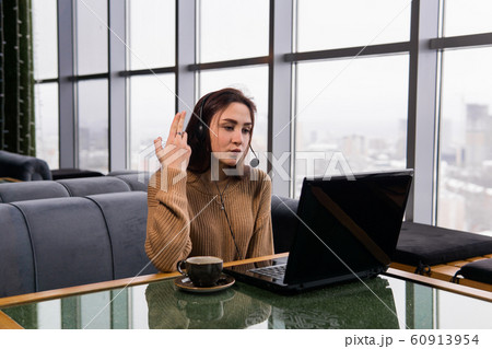 girl leads some online broadcast from the coffee 60913954