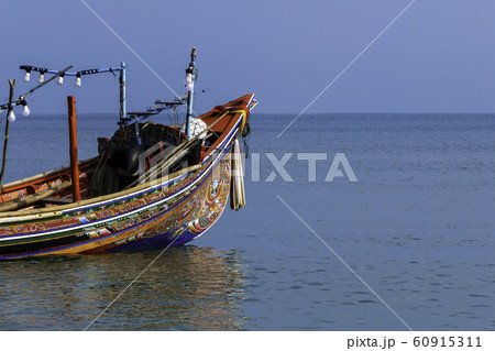 Kolek boat is a folk fishing boat made of wood and painted with beautiful coloring patterns. 60915311