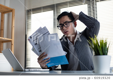 Asian man is stressed and overthink by debt from 60919320