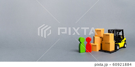Yellow Forklift truck with cardboard boxes near a customer buyer and seller. Business and commerce. Negotiations on supply of goods. The organization of the supply of outlets goods. Banner, copy space 60921884