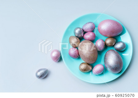 Colored chicken and quail eggs of pink, silver, golden and blue color Colored chicken and quail eggs of pink, silver, golden and blue color 60925070