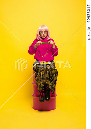 Caucasian woman's portrait isolated on yellow studio background, influencer be like Caucasian woman's portrait isolated on yellow studio background, influencer be like 60928017