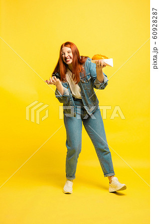 Caucasian woman's portrait isolated on yellow studio background, follower be like Caucasian woman's portrait isolated on yellow studio background, follower be like 60928287