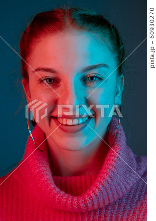 Caucasian woman's portrait isolated on gradient studio background in neon light Caucasian woman's portrait isolated on gradient studio background in neon light 60930270