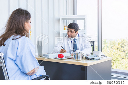 Doctor work consulting and examining patient woman or sick person for her health in seriously Doctor work consulting and examining patient woman or sick person for her health in seriously 60930312