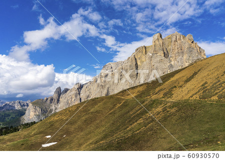 Peaks of Dolomites in the afternoon light. 60930570