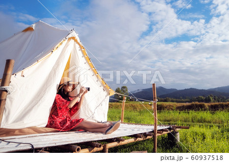 Asian girl take a photo by camera in Countryside 60937518