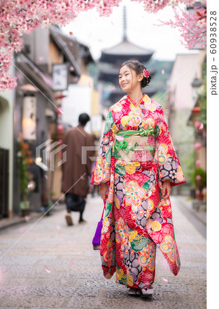 Japanese girl walk in kyoto old market and wooded 60938528