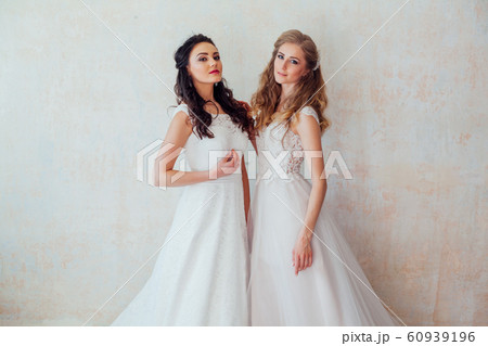 two brides on wedding wedding blonde brunette 60939196