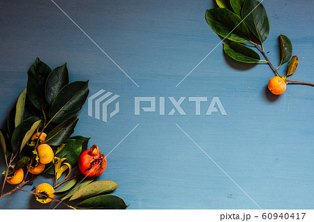 autumn red and yellow leaves of the fruit pomegranate persimmon autumn red and yellow leaves of the fruit pomegranate persimmon 60940417