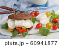 Sandwich with rye bread, goat cheese, tomatoes, 60941877