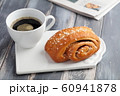 Cinnamon roll and a cup of coffee 60941878