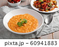 Pumpkin soup decorated with basil in a vegetarian 60941883