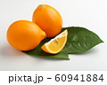 Orange colored lemons on a cutting board 60941884