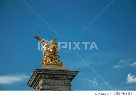 Column with golden statue over the Seine River in Paris Column with golden statue over the Seine River in Paris 60946337