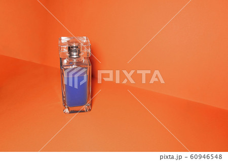 Transparent glass bottle with blue liquid on 60946548
