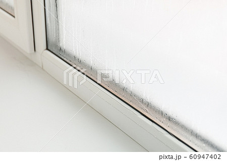 Plastic window with damp and water condensation Plastic window with damp and water condensation 60947402