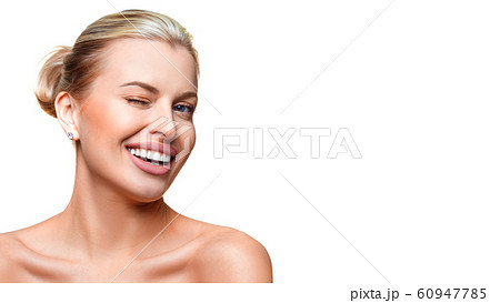 Portrait of a young woman with clear fresh skin winking. Isolated on white background. Portrait of a young woman with clear fresh skin winking. Isolated on white background. 60947785