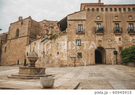 Fountain in square encircled by gothic buildings at Plasencia Fountain in square encircled by gothic buildings at Plasencia 60948918