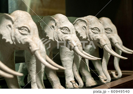 Beautiful Ceramic Elephants Statue on the Table 60949540