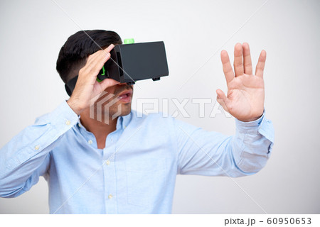 Entrepreneur in VR headset watching presentaion 60950653