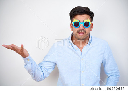 Funny businessman shrugging shoulders Funny businessman shrugging shoulders 60950655