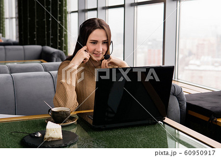 girl leads some online broadcast from the coffee 60950917