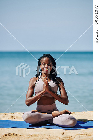 Pretty woman in lotus position Pretty woman in lotus position 60951077