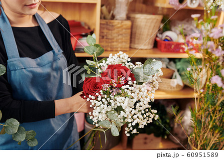 Florist showing beautiful bouquet Florist showing beautiful bouquet 60951589