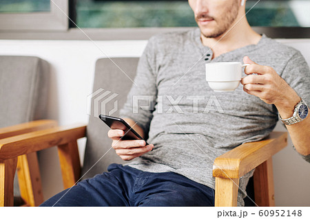 Man checking smartphone Man checking smartphone 60952148